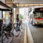Bikers waiting for bus